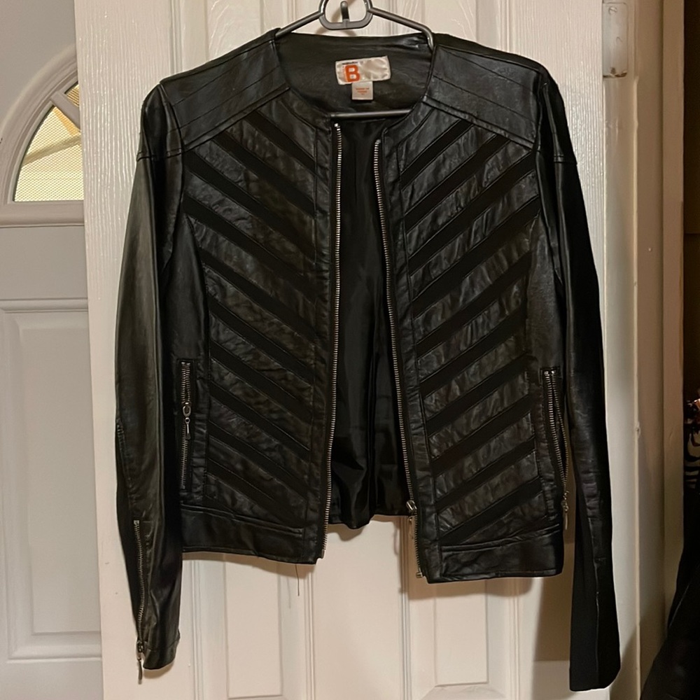 Black Bernardo faux leather Moto jacket with chevron stripes on the front